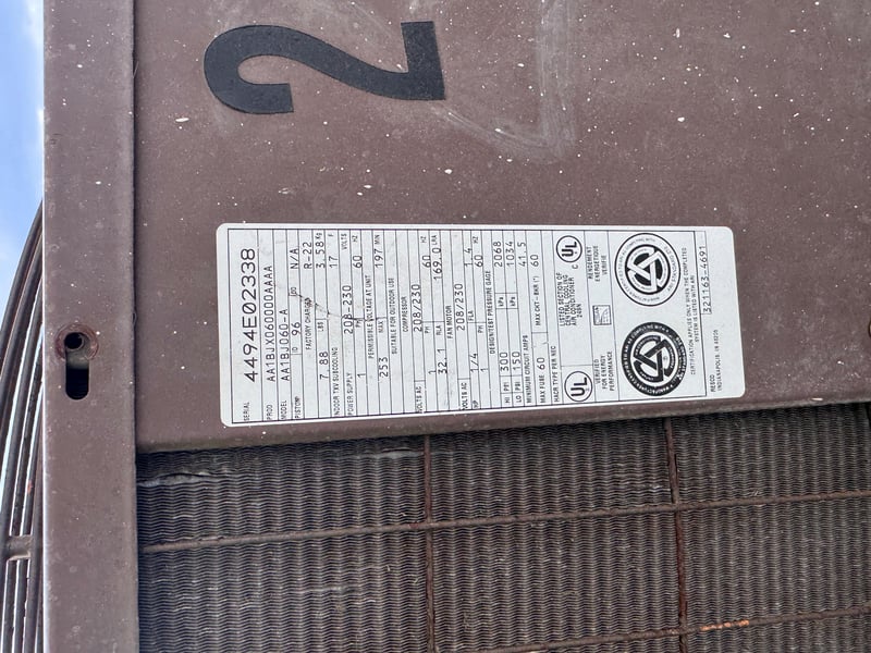 Condenser numbered 2 with corroded coil fins at 11700 New Kings Rd, Jacksonville, FL 32219