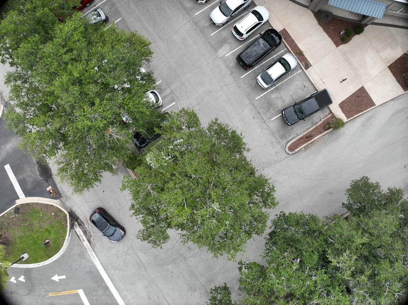Aerial view of oak tree canopy and parking lot at 9406 Atlantic Blvd, Jacksonville, FL 32225