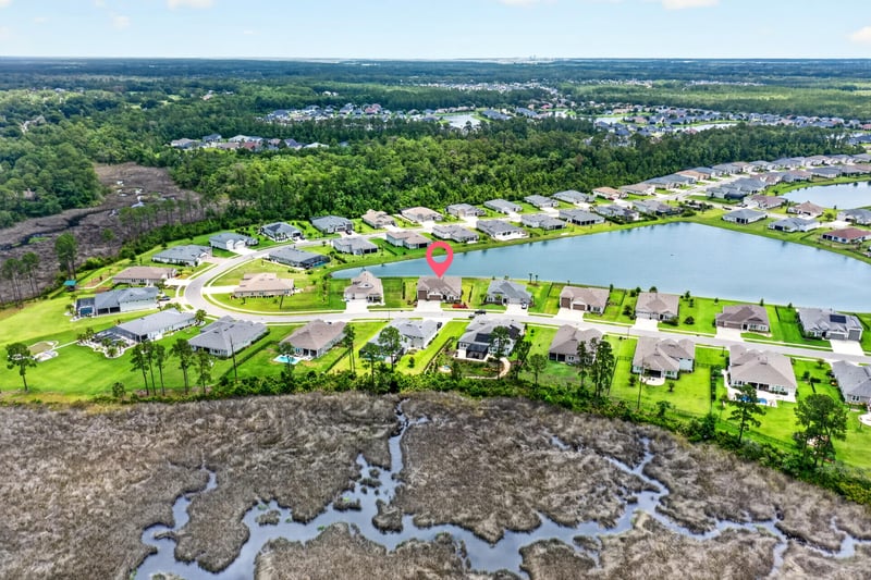 Drone view of the neighborhood pond and streets in Fernandina Beach, FL