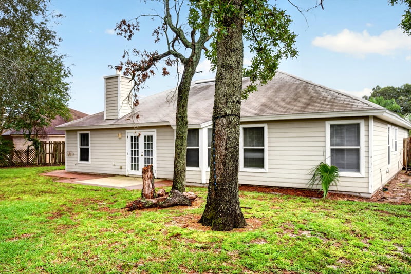 Backyard with mature trees at 12949 Chets Creek Dr S, Jacksonville, FL 32224