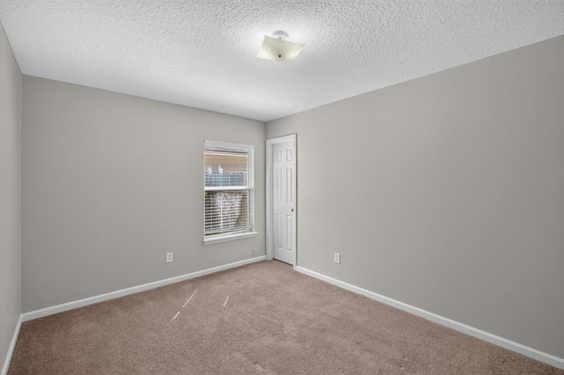 Carpeted bedroom with window at 14147 Fish Eagle Dr E, Jacksonville, FL 32226