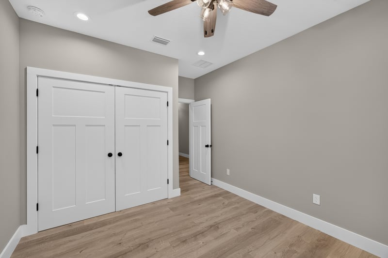 Bedroom with closet doors and tray ceiling at 175 Alava Ct