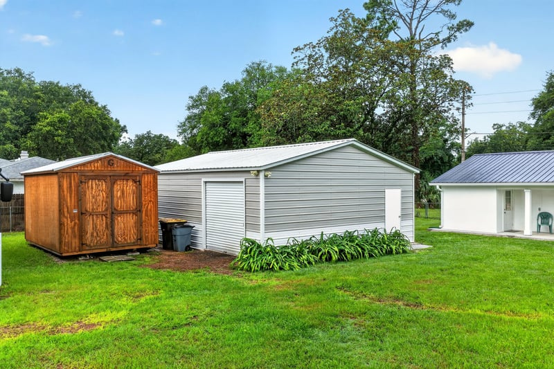 Aerial view of detached garage and green yard at 1619 Hammond Blvd, Jacksonville, FL