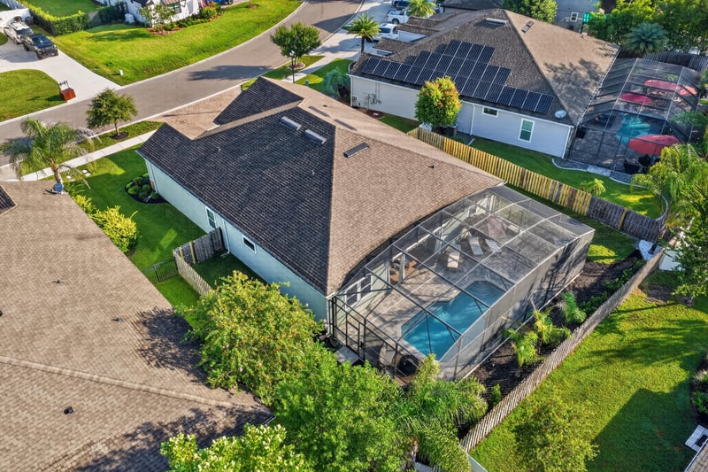 Aerial view of the roof and pool enclosure at 3328 Southern Oaks Dr, Green Cove Springs, FL 32043