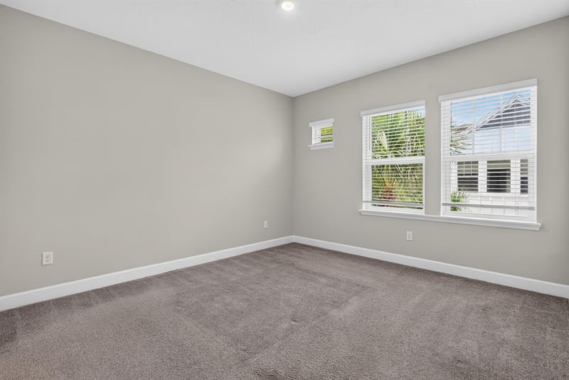 Bedroom with window and carpet at 7446 Loggerhead Ct, Jacksonville, FL 32256