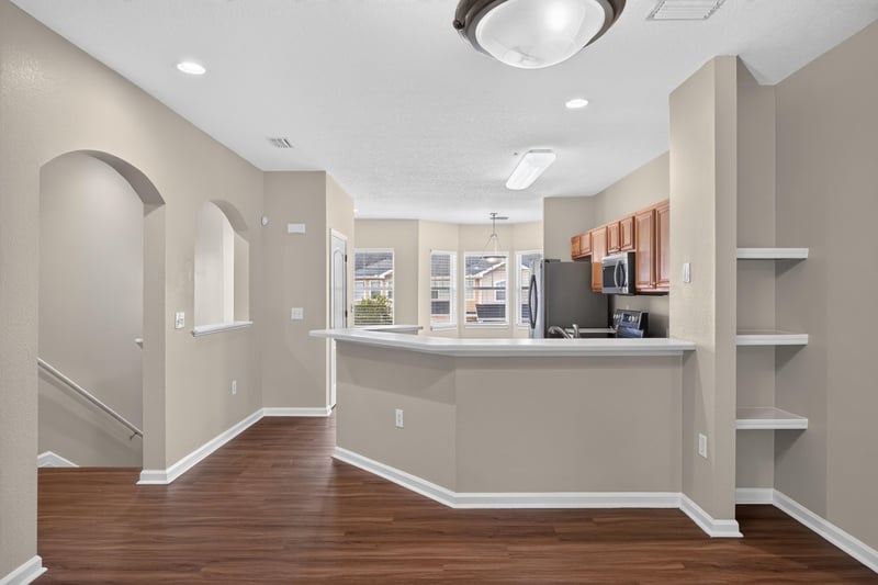 Staircase with kitchen counter in view at 3750 Silver Bluff Blvd, Orange Park, FL
