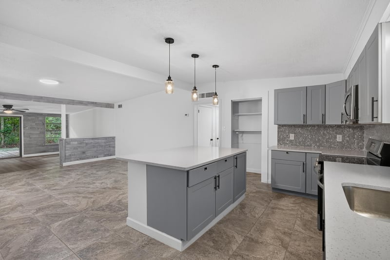 Kitchen island view with vaulted ceiling at 3113 Kline Rd, Jacksonville, FL 32246