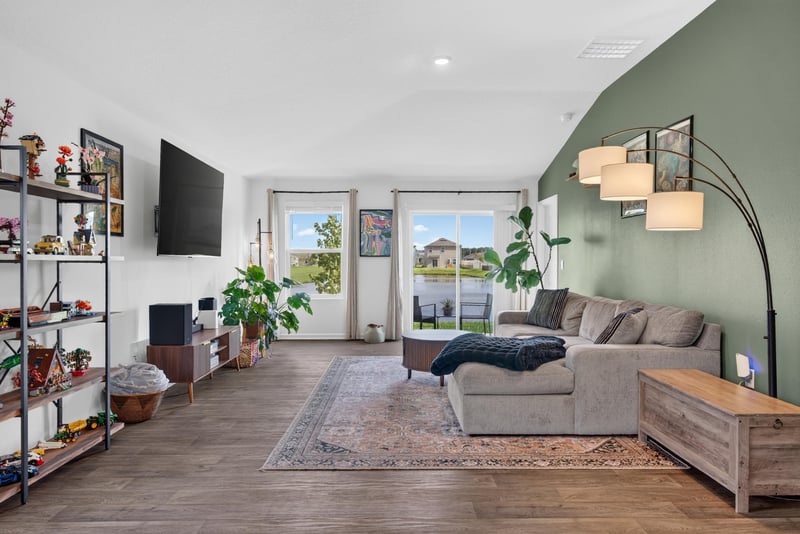 Living room with shelving and television at 4276 Quaking St, Jacksonville, FL 32218