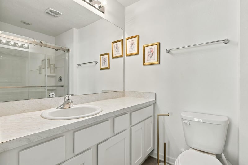 Bathroom vanity with mirror and framed art at 8359 Zenith Cir, Jacksonville, FL 32256