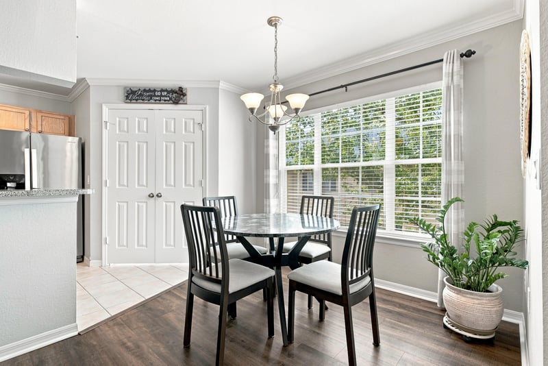 Dining area with round table and chandelier at 7800 Point Meadows Dr, Jacksonville, FL 32256