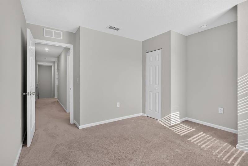 Upstairs hallway with doors to bedrooms at 4024 Bay Hawk Ct, Jacksonville, FL
