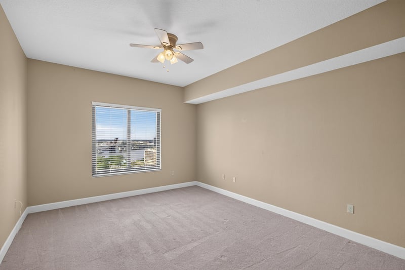 Bedroom with ceiling fan and window at 1478 Riverplace Blvd 1904, Jacksonville, FL 32207