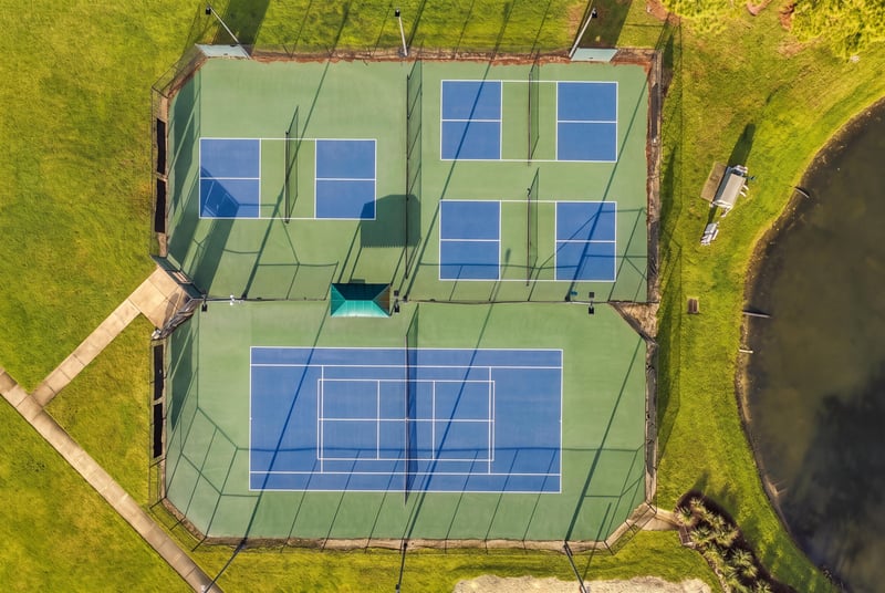Aerial view of community tennis courts in Murabella