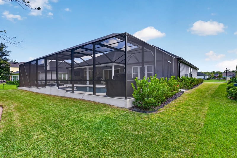 Exterior view of the screened lanai structure at 785 Back Creek Dr, St. Augustine, FL 32092