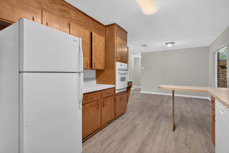 Kitchen with refrigerator and cabinets at 5503 Boeing Dr, Jacksonville, FL 32207