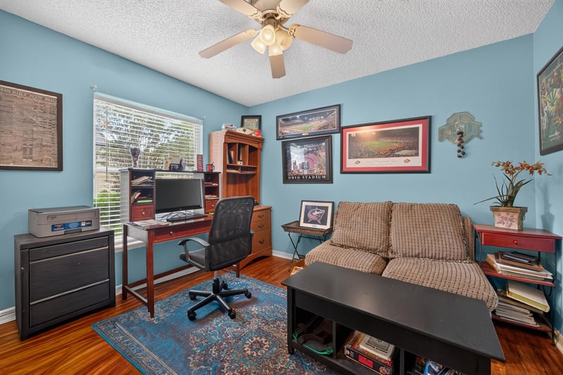 Bedroom office with desk and loveseat at 145 Dover Bluff Dr, Orange Park, FL