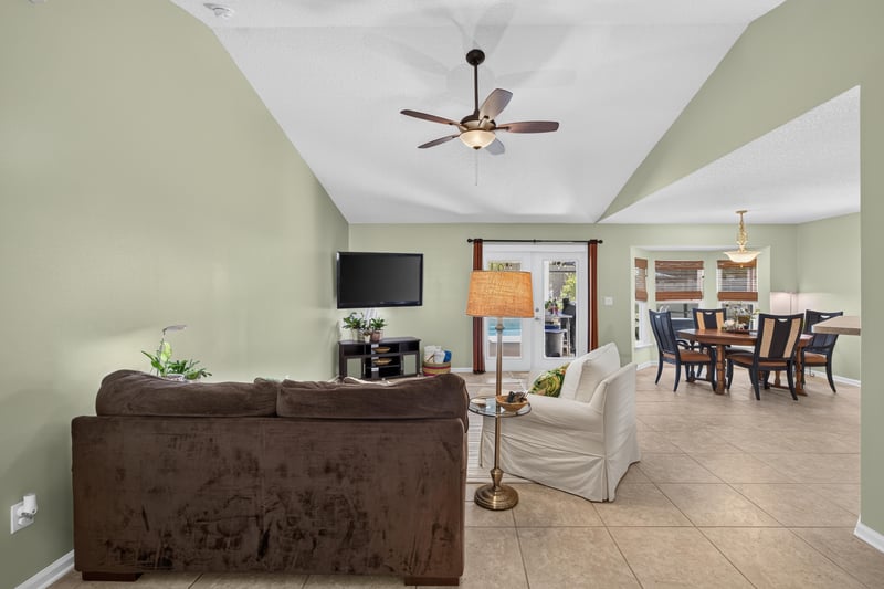 Living room open to dining area at 1589 Backwater Drive, Middleburg, FL 32068
