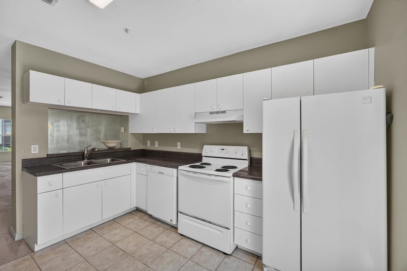 Kitchen with white range and refrigerator at 342 E Ashley St, Jacksonville, FL 32202