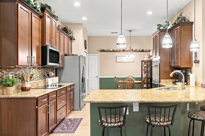 Kitchen with granite counters and pendant lighting at 10923 Black Diamond Ct, Jacksonville, FL