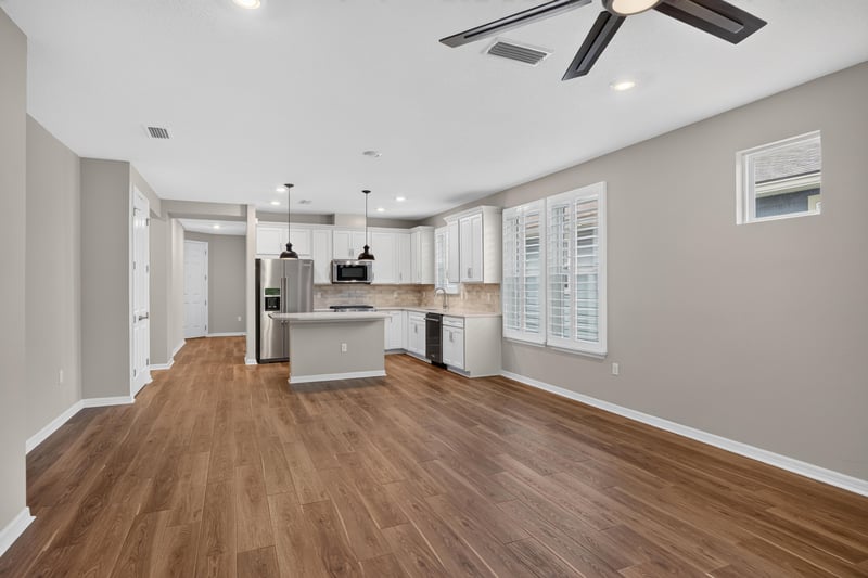 Kitchen with white cabinets and center island at 171 Oyster Shell Ter, Nocatee, FL 32081
