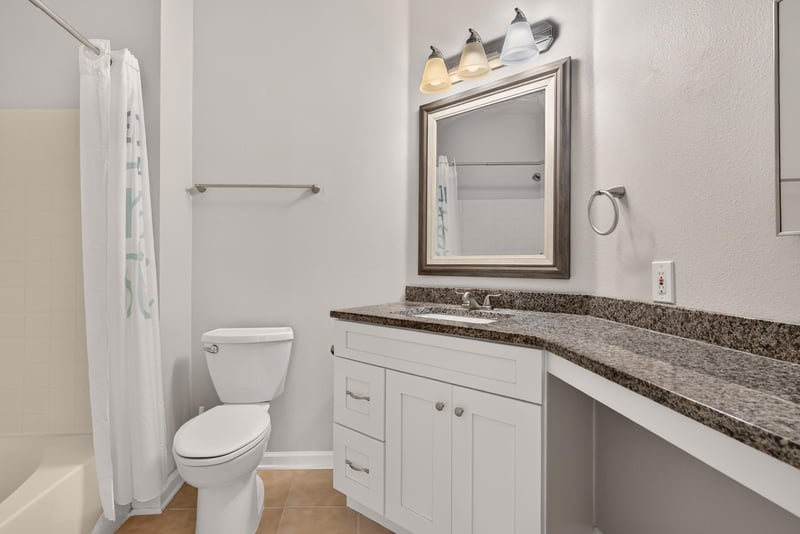 Bathroom with granite vanity at 7990 Baymeadows Rd E #404, Jacksonville, FL 32256