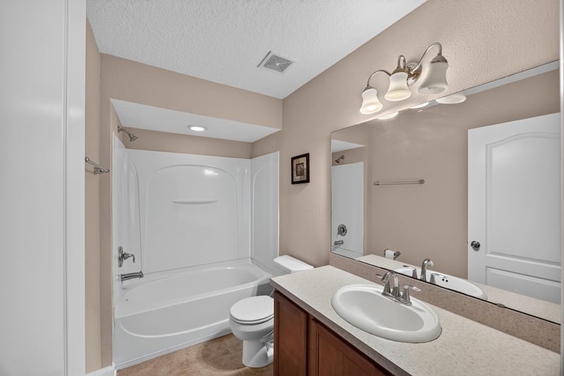 Bathroom with tub-shower combo and vanity at 3762 Hartsfield Forest Cir, Jacksonville, FL 32277