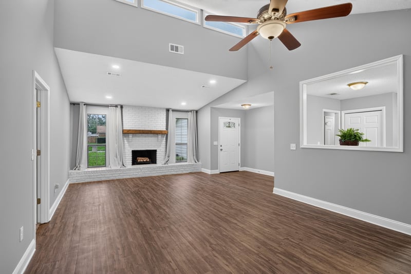 Living and dining area with wood floors and windows at 12344 Cormorant Ct, Jacksonville, FL