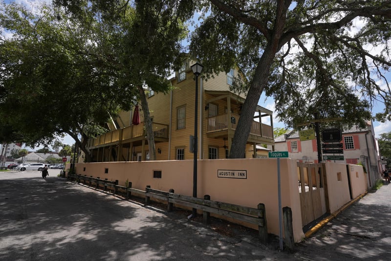 Side exterior and gated walkway along the property at 29 Cuna St, St. Augustine, FL 32084