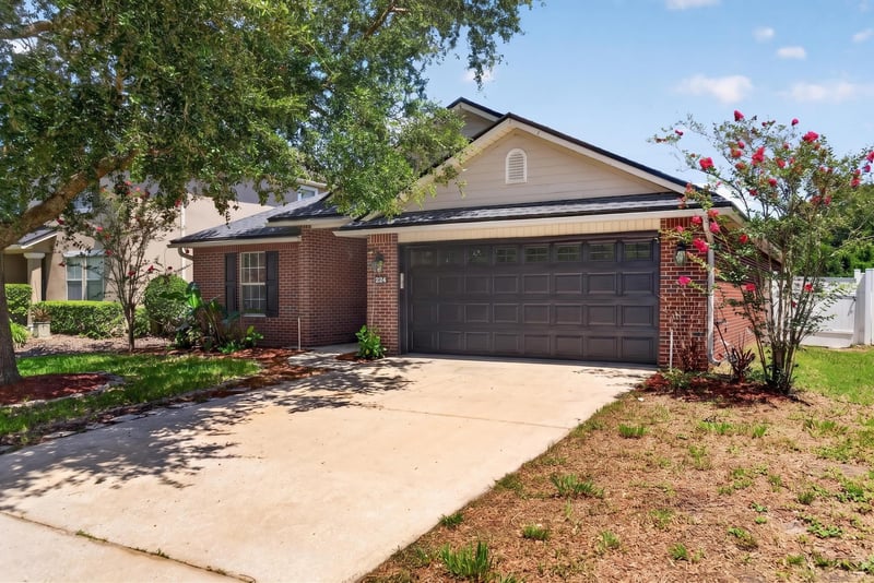 Front exterior with driveway and landscaping at 224 Pine Arbor Cir, St. Augustine, FL 32084