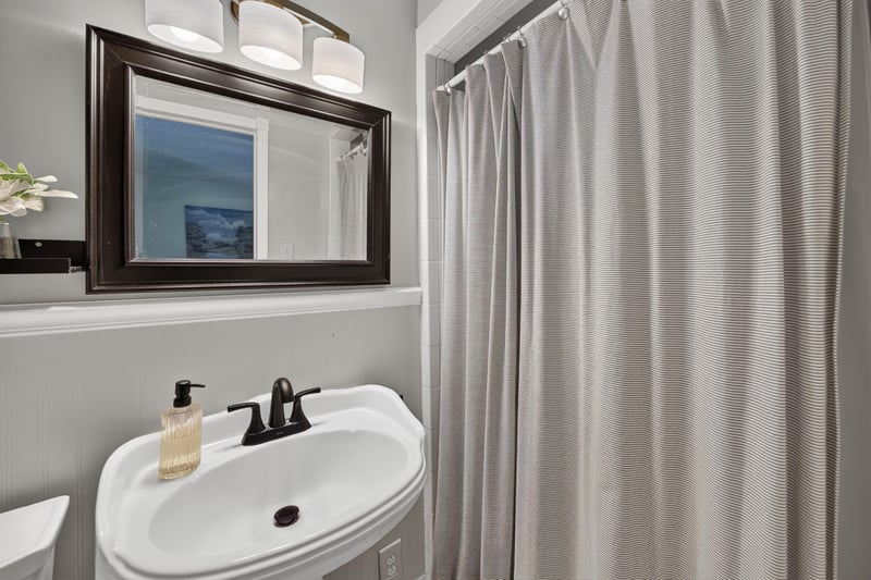 Second pedestal sink in shared bathroom at 5843 Ovella Rd, Jacksonville, FL 32244