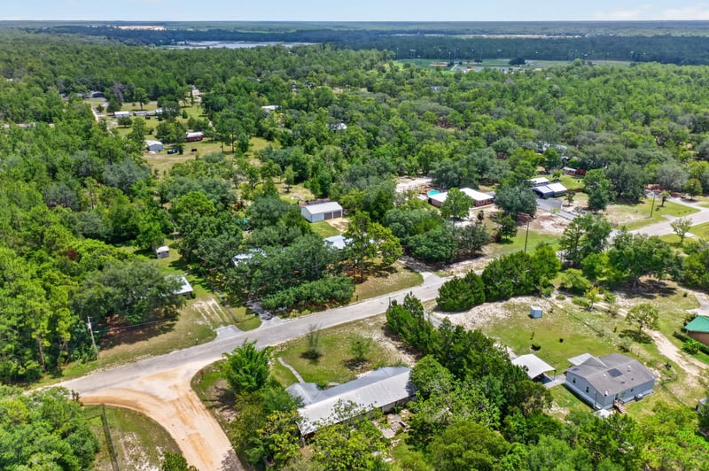 Aerial view of dirt road and scattered homes in Keystone Heights, FL