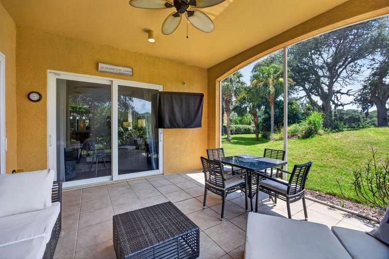 Covered lanai overlooking green space at 140 Ave De La Mer, Palm Coast, FL 32137