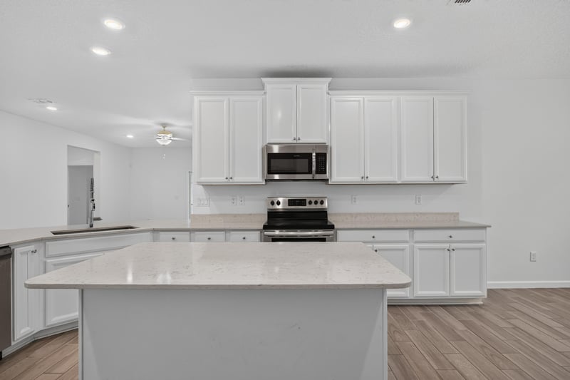 Kitchen island with pendant lighting at 9905 Ansley Lake Dr, Jacksonville, FL