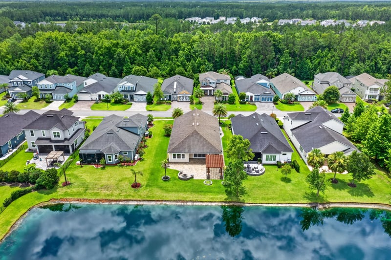 Aerial view of neighborhood pond in St. Johns, FL