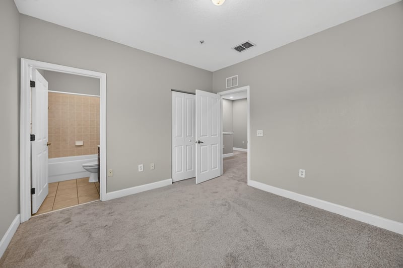 Tiled hallway with two doors at 9745 Touchton Rd, Jacksonville, FL 32246