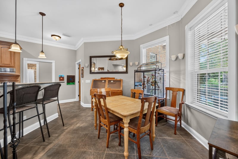 Breakfast nook with table and bar stools at 1735 Hagans Ridge Ct