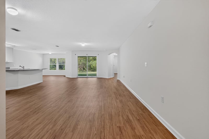 Living room with window and wood flooring at 95221 Siena Ct, Fernandina Beach, FL 32034