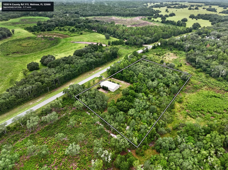 Drone aerial of the property and the county road at 1038 County Rd 315, Melrose