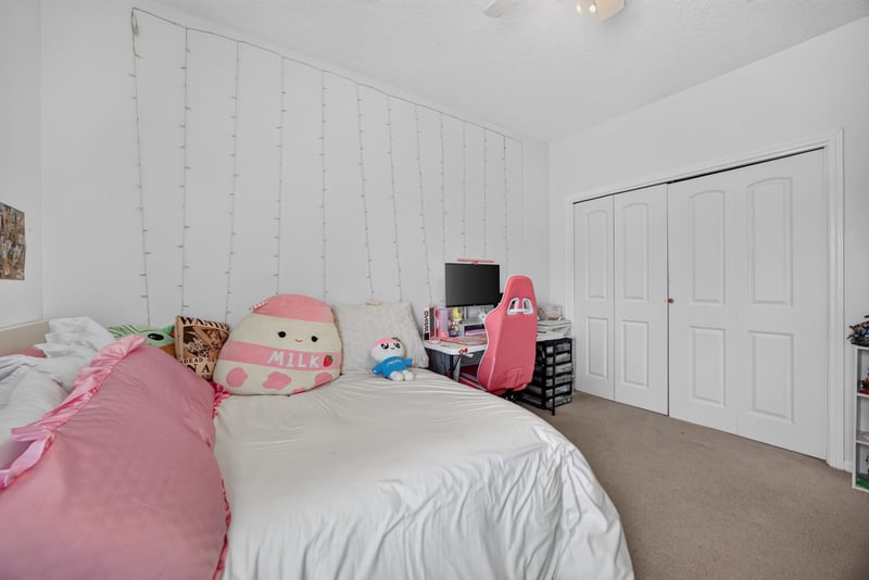 Bedroom with closet and bedding at 2875 Pebblewood Ln, Orange Park, FL 32065