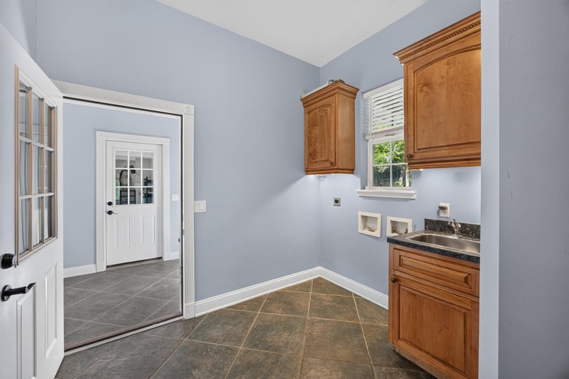 Mudroom with tile floor and cabinets at 1735 Hagans Ridge Ct