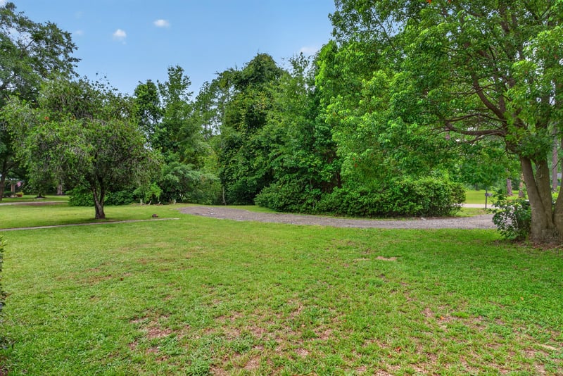 Wooded section of the property with open grass at 3249 Maryland Ave, Green Cove Springs, FL