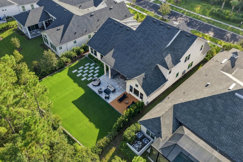 Aerial view of the backyard patio and lawn at 907 Seagrove Dr, Ponte Vedra Beach, FL 32081