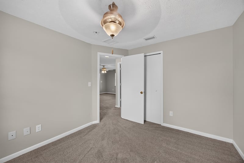 Bedroom with ceiling fan and doors at 1143 Tumbleweed Dr, Orange Park, FL 32065