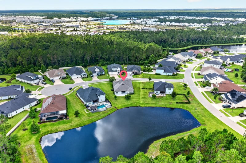 Wide aerial view of lake and neighborhood streets in St. Augustine, FL