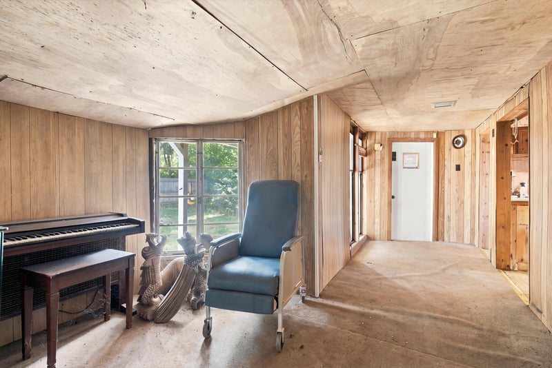 Den with piano and paneled walls at 1807 Idlewild Ave, Green Cove Springs, FL