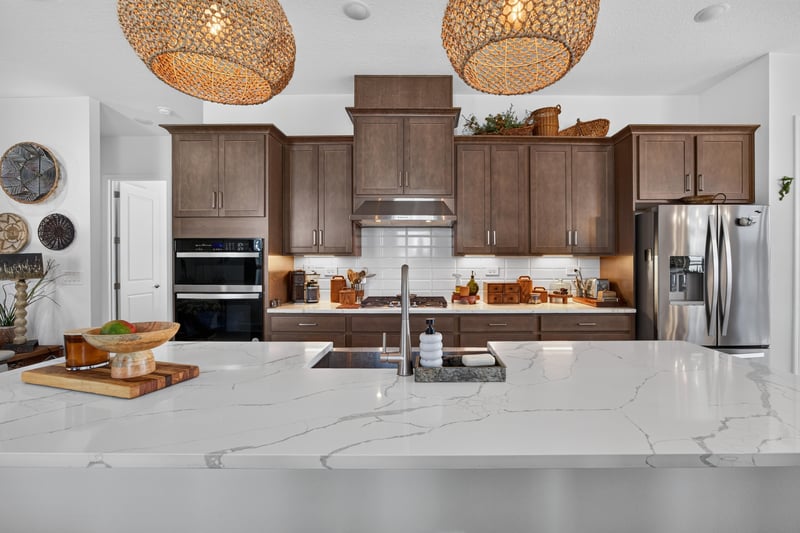 Kitchen with dark wood cabinets and stainless appliances at 129 Amberwood Dr, St. Augustine, FL