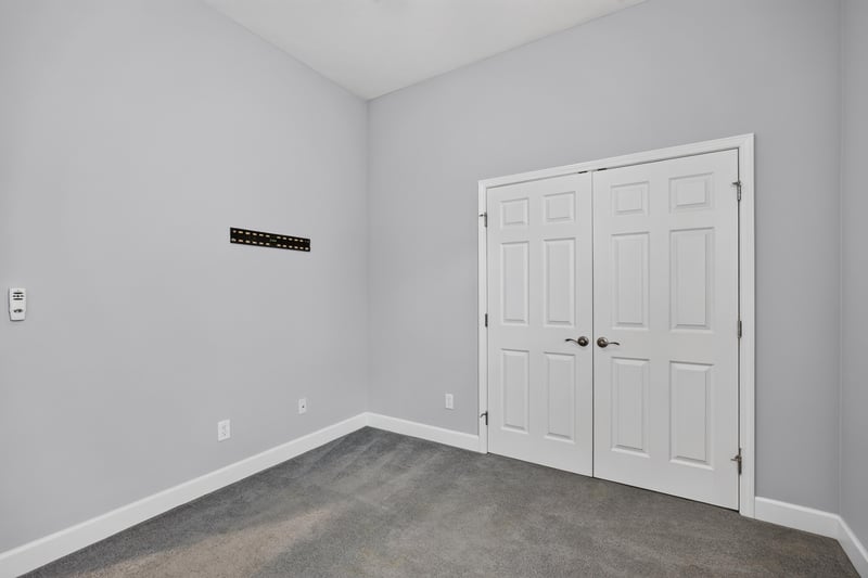 Bedroom with double closet doors at 6217 Eclipse Cir, Jacksonville, FL 32258