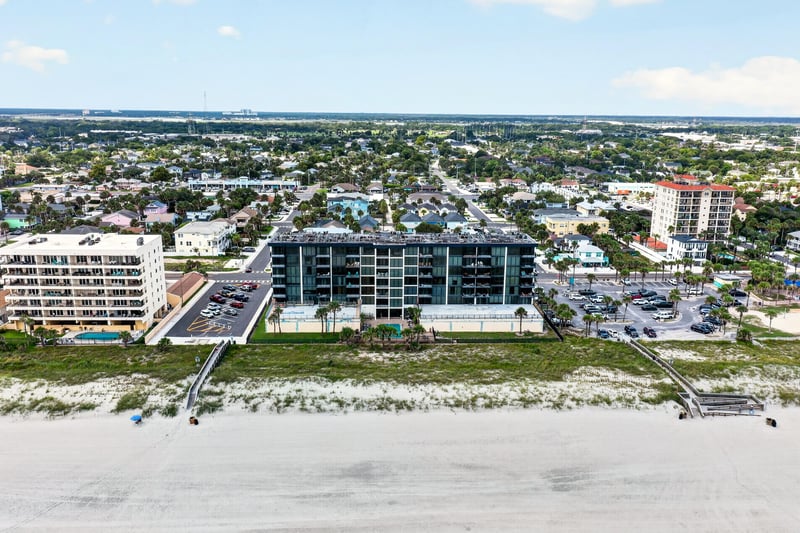 Aerial view of the building along the beach at 601 1st St S, Jacksonville Beach