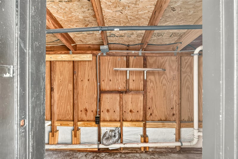 Garage interior with wood framing and shelving at 4039 Habana Ave, Jacksonville, FL