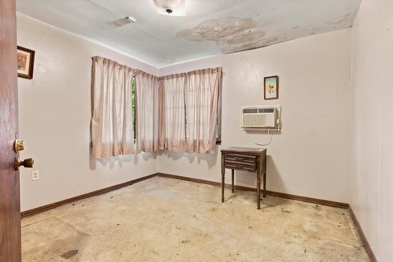 Bedroom with wall air conditioner and carpet at 1807 Idlewild Ave, Green Cove Springs, FL
